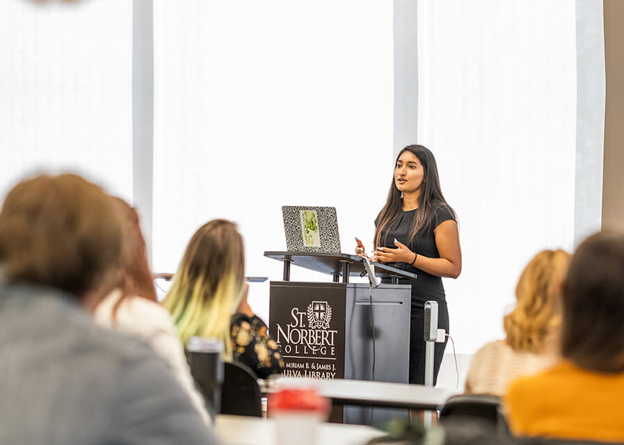 Female student presents to a group