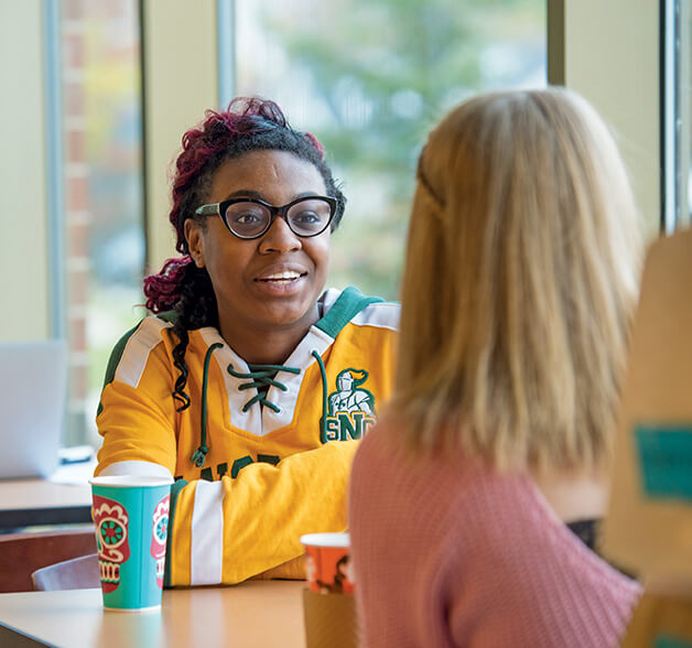 Students chat over coffee