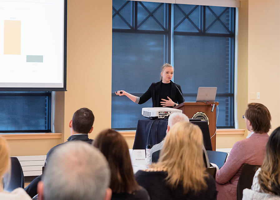 A speaker speaking during a seminar