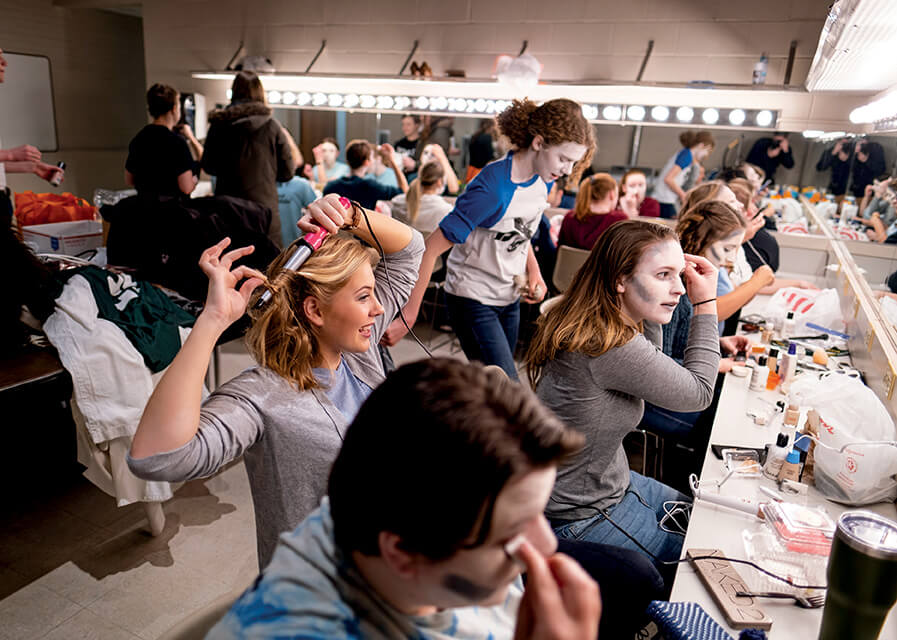 Art students getting ready for a show