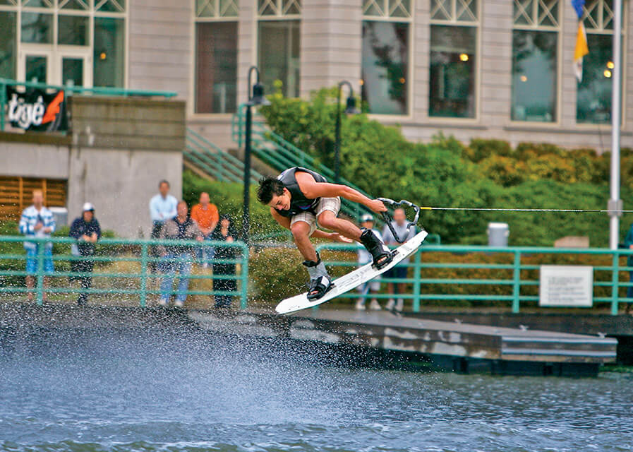 Student surfing on the fox river