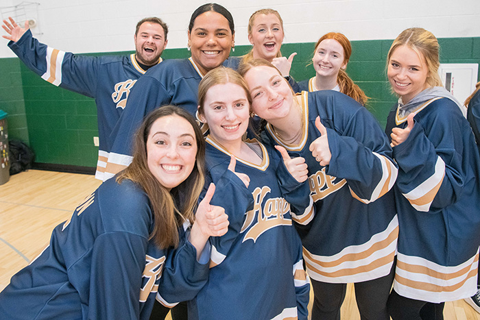 Students posing for a photo in attire promoting their social groups